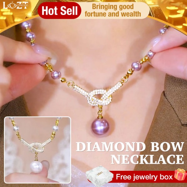 Diamond bow necklace